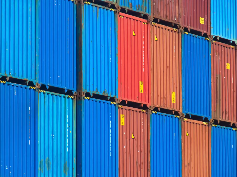 Stacked shipping containers in blue and red